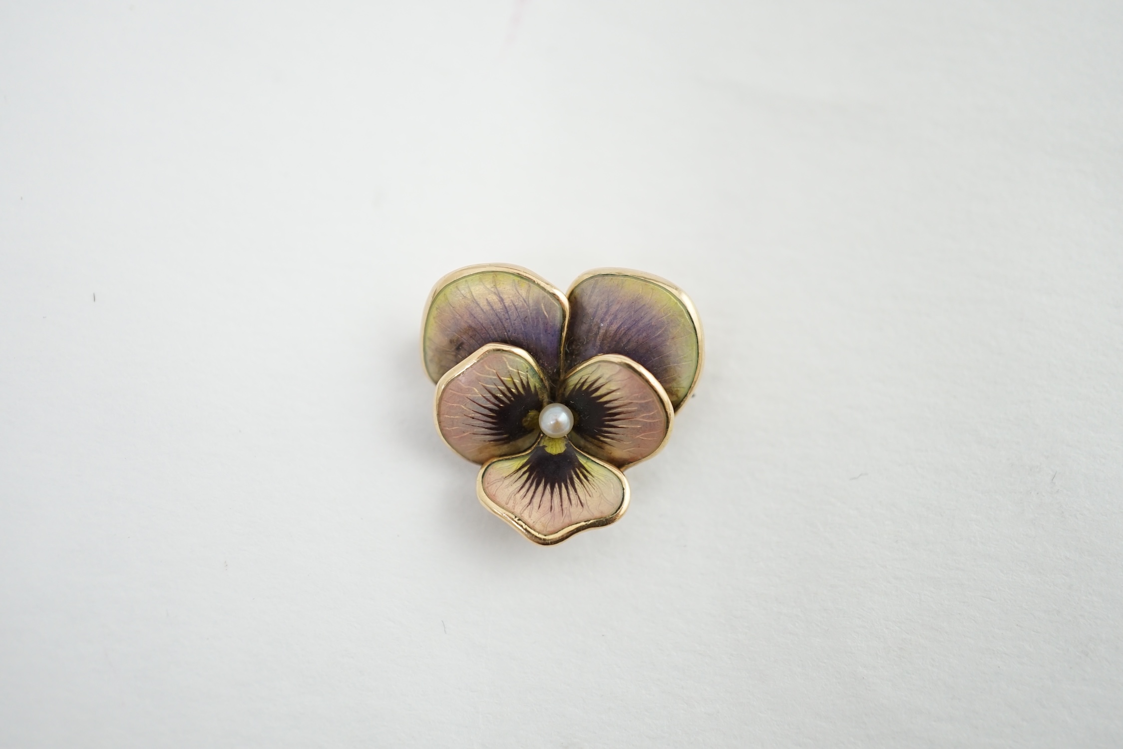 An early 20th century American 14k, enamel and seed pearl set pansy brooch, by Crane & Theurer